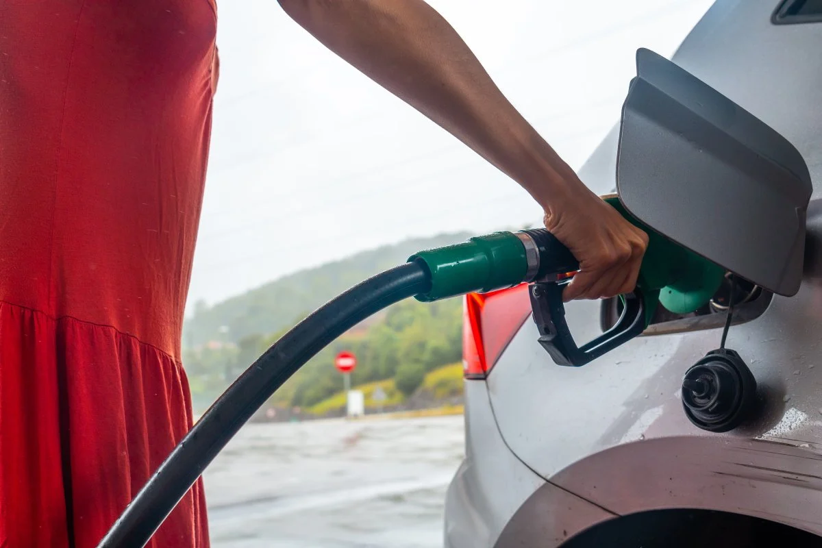 woman refueling gasoline at the gas station in Greeley CO